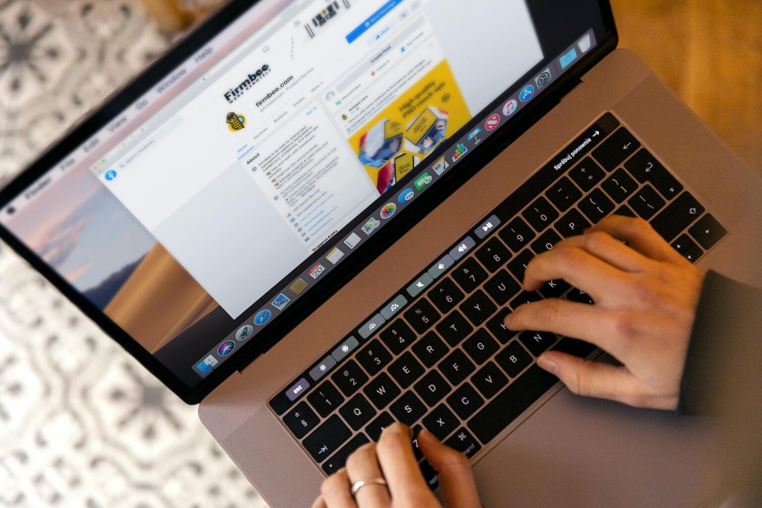 a person typing on a laptop